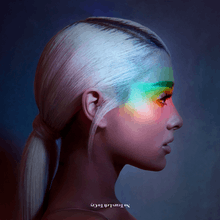 The cover shows Grande's profile with a rainbow light cast across her face.
