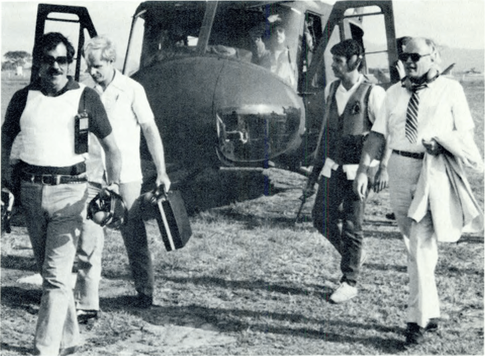Armed Department of State security agents accompany U.S. Ambassador Deane Hinton in El Salvador circa 1982.png