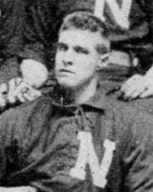 A man in a dark baseball uniform with a white "N" on the chest.