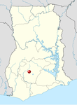 A blank map of a rectangular-looking country with a red dot in the south-west marking the location of the site.