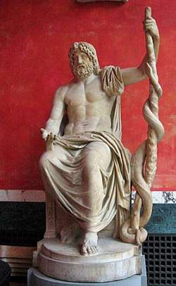 Marble statue of Asclephius on a pedestal, symbol of medicine in Western medicine
