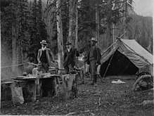  Peter Kaufmann (right) with Boston attorney and American Alpine Club President Lewis Delafield (middle) at the Canadian Alpine Club encampment at Rogers Pass (July 1908). Kaufmann spent a month in the Rockies climbing with Delafield. Photo courtesy E. Kaufmann, Grindelwald.