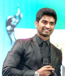 A picture of Atharvaa as he looks at the camera