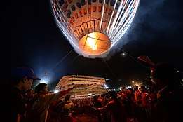 Fireworks being attached to hot air balloon