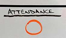 "Attendance" in capital letters written in black marker on a whiteboard, with a large orange zero beneath it