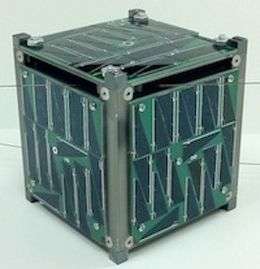 A cube with green and grey panelled sides, black and grey edges