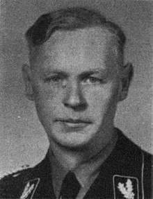 a black and white photograph of a male in uniform