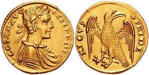 A gold coin, which depicts the bust of a man and an eagle