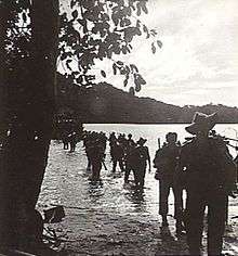 Infantry wading ashore from a landing craft