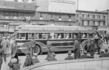 Colonial Coach Lines bus on the square of the Phillips Street in Montreal,1937.