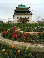 Pagoda-style temple, with flower garden in front