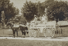 White horse-drawn fire engine