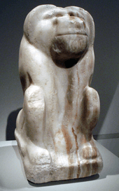 Crude stone statue of a baboon