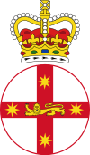 Crest featuring crown atop white disk with red cross, and lion in centre