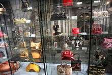 a few purses from the collection on shelves