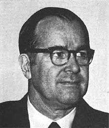A headshot of Representative Barber Conable, a man in his 50s wearing a suit and thick-rimmed glasses