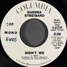 A white vinyl record of the single appears