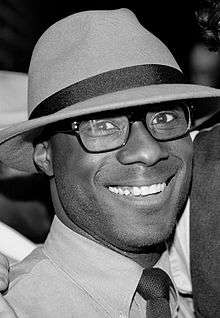 A black and white photograph of Barry Jenkins attending his 30th birthday party