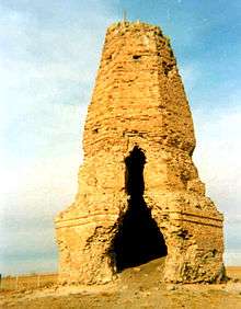 Tall, sand-colored stupa