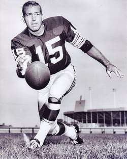 A photo of Bart Starr pitching the football towards the camera