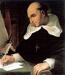 Painting of a balding man sitting at a desk and writing with a quill. He wears a dark religious robe and with a white hood and white undersleeves, and a crucifix pendant and is looking down at the three sheets of paper in front of him. His left hand is resting on an armrest.
