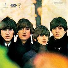 A photo of the Beatles – George, John, Ringo, and Paul