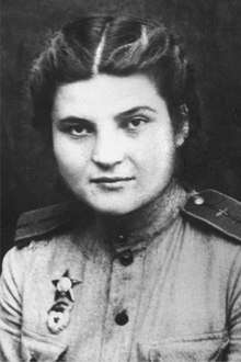 Photograph of Vera Belik. She is wearing a Guards pin and an Order of the Red Star medal.