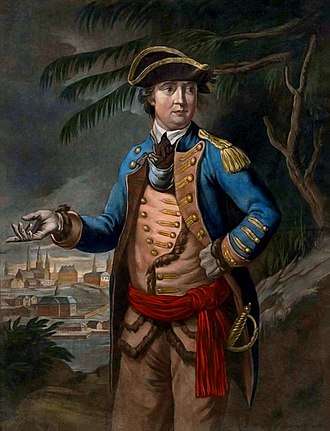 Arnold is shown wearing a military uniform: blue coat over buff waistcoat and trousers, red waistband, tricorner hat.  In the background a town is visible, as are trees that look something like palm trees.
