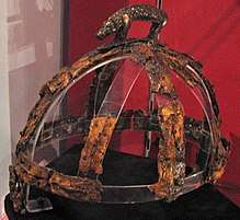 Colour photograph of the Benty Grange helmet, which has a freestanding boar atop its crest
