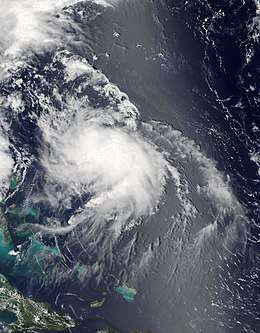 A visible satellite image depicting a disorganized hurricane located northeast of the Bahamas on August 4.