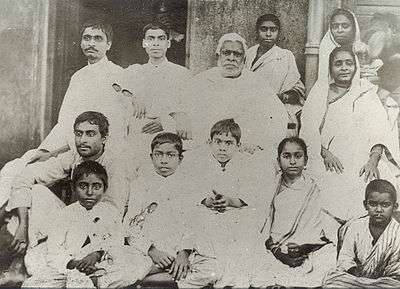 A group photograph of a large Indian family