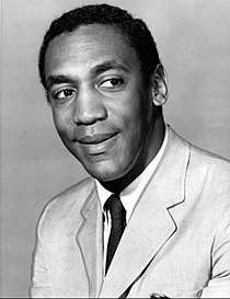 A black and white image of comedian Bill Cosby, who portrays Clair's husband Cliff.
