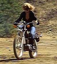 Danuta Wesley as Black Canary on her signature motorcycle in Legends of the Superheroes