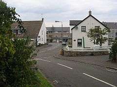 A road junction with houses either side