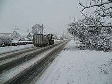 tractor and trailer on snowy road