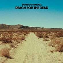 An empty desert road with hills in the background. Black bold text above reads "Boards of Canada Reach for the Dead".