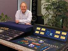 Bob Ludwig sitting behind a control panel