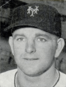 A close-up of a man wearing a baseball cap with an "NY" on the cap.