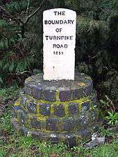 Turnpike marker 1852 showing southwest boundary of Ely