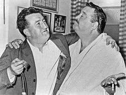 Gleason standing with Irish author Brendan Behan, arms around each other