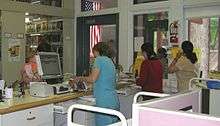 Librarians helping patrons at the circulation desk