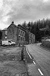 View uphill along a road to a pub