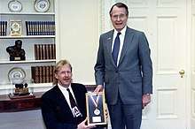 President George H.W. Bush presents Kevin Saunders with a medal to commemorate his contributions to the President's Council on Fitness, Sports, and Nutrition.