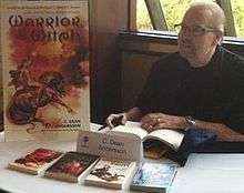 C. Dean Andersson signs books at FenCon in Dallas, Texas, September 2012 (photographed by Christopher Fulbright)