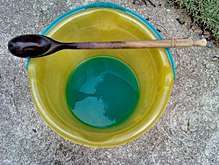 blue-green liquid in a bucket