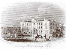 Illustration of a grand hotel in the middle distance, groups of figures in 19th-century dress in the foreground