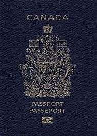 A navy blue passport cover with a gold-coloured crest.  Text reads "CANADA" above the crest and "PASSPORT" and "PASSEPORT" below