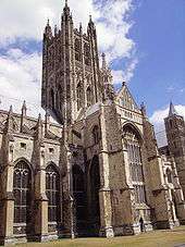 The tower at Canterbury is seen rising high above one of the transepts. It is in two stages, with pairs of tall arched windows in each stage. At the four corners are buttresses, which are much ornamented and terminate in four large carved pinnacles.