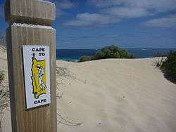 Picture of Cape to Cape track marker on a beach.