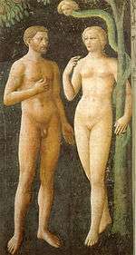 A fresco showing Adam and Eve tempted by the Devil. Eve holds a piece of fruit while Adam gestures towards  it. The figures look slim, youthful and beautiful. Adam is bearded and tanned; Eve is blonde and pretty.